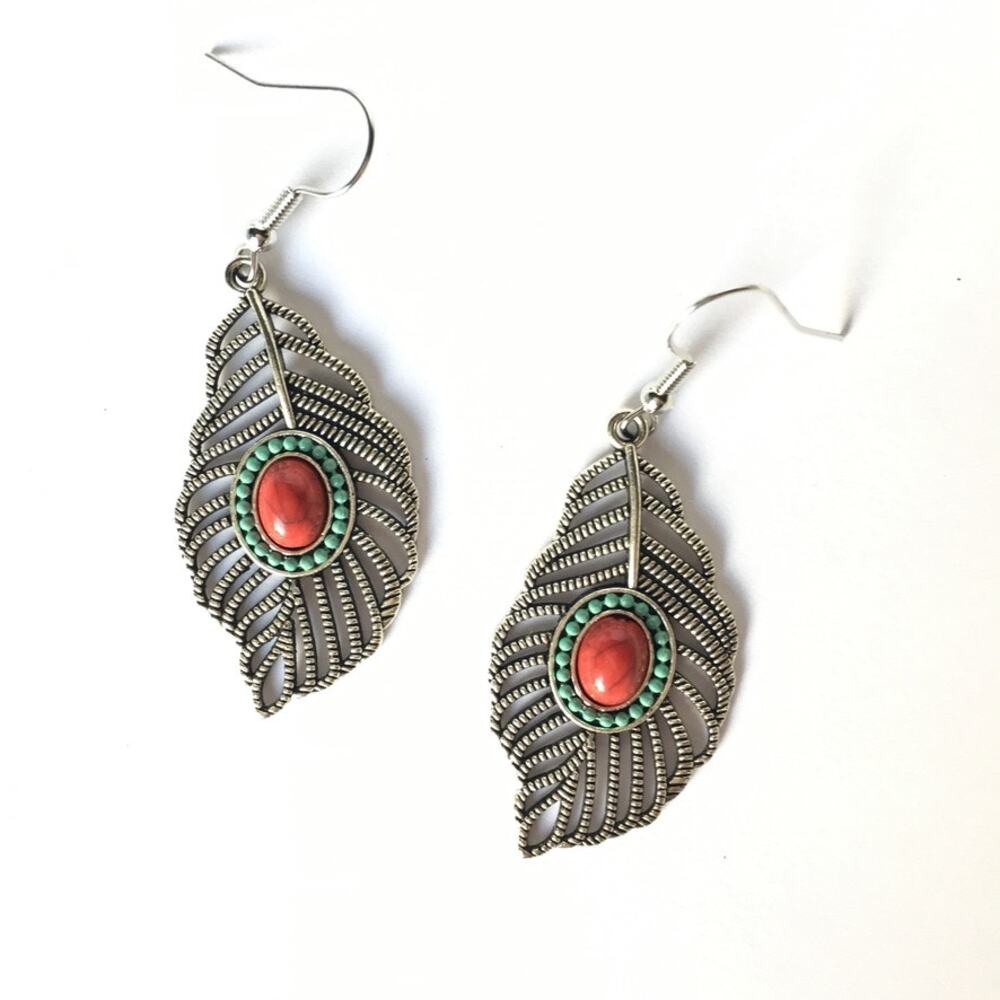 Silver tone feather earrings, red cabochon & faux turquoise accents